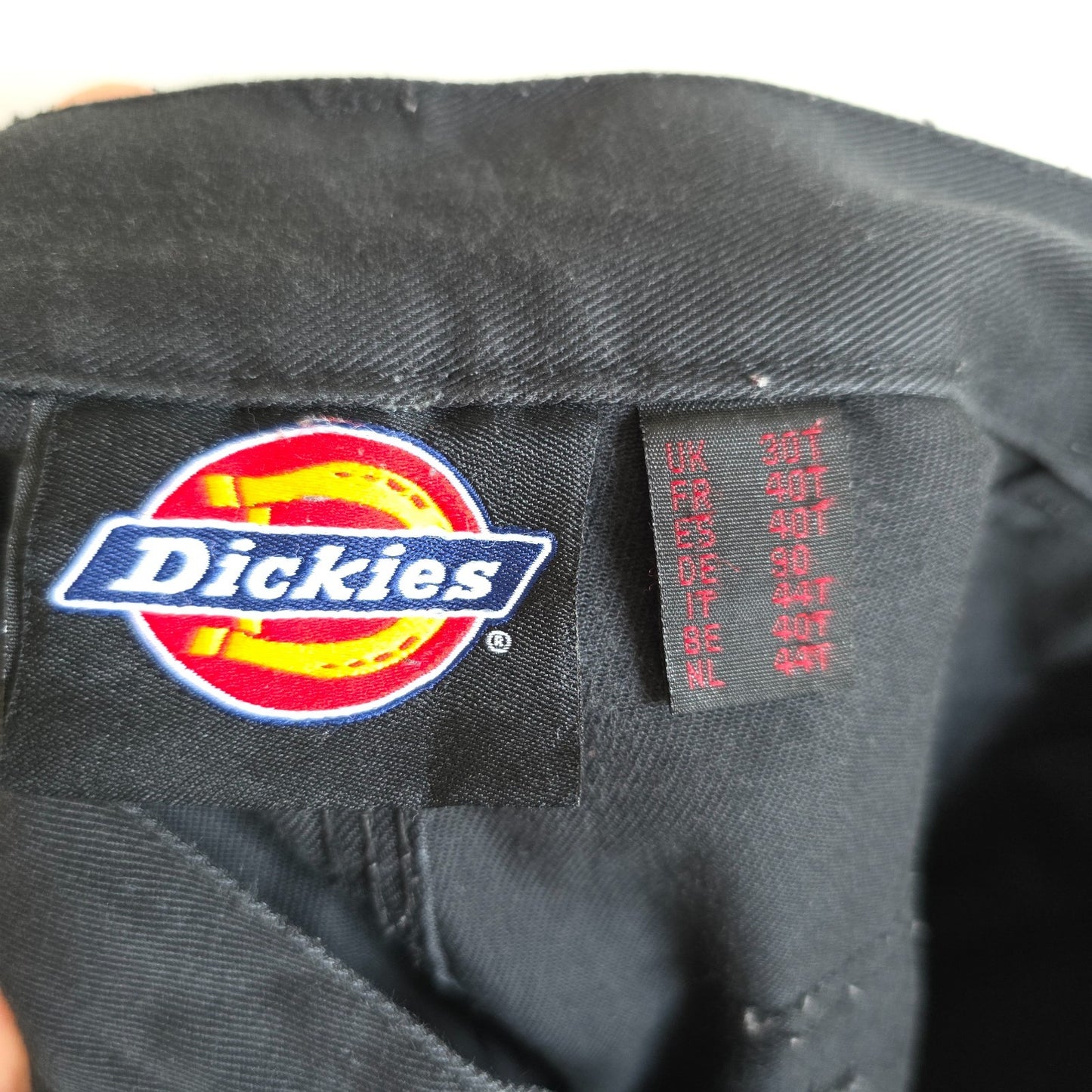 Dickies black cargo trousers with double knee panels and hammer loop detail.