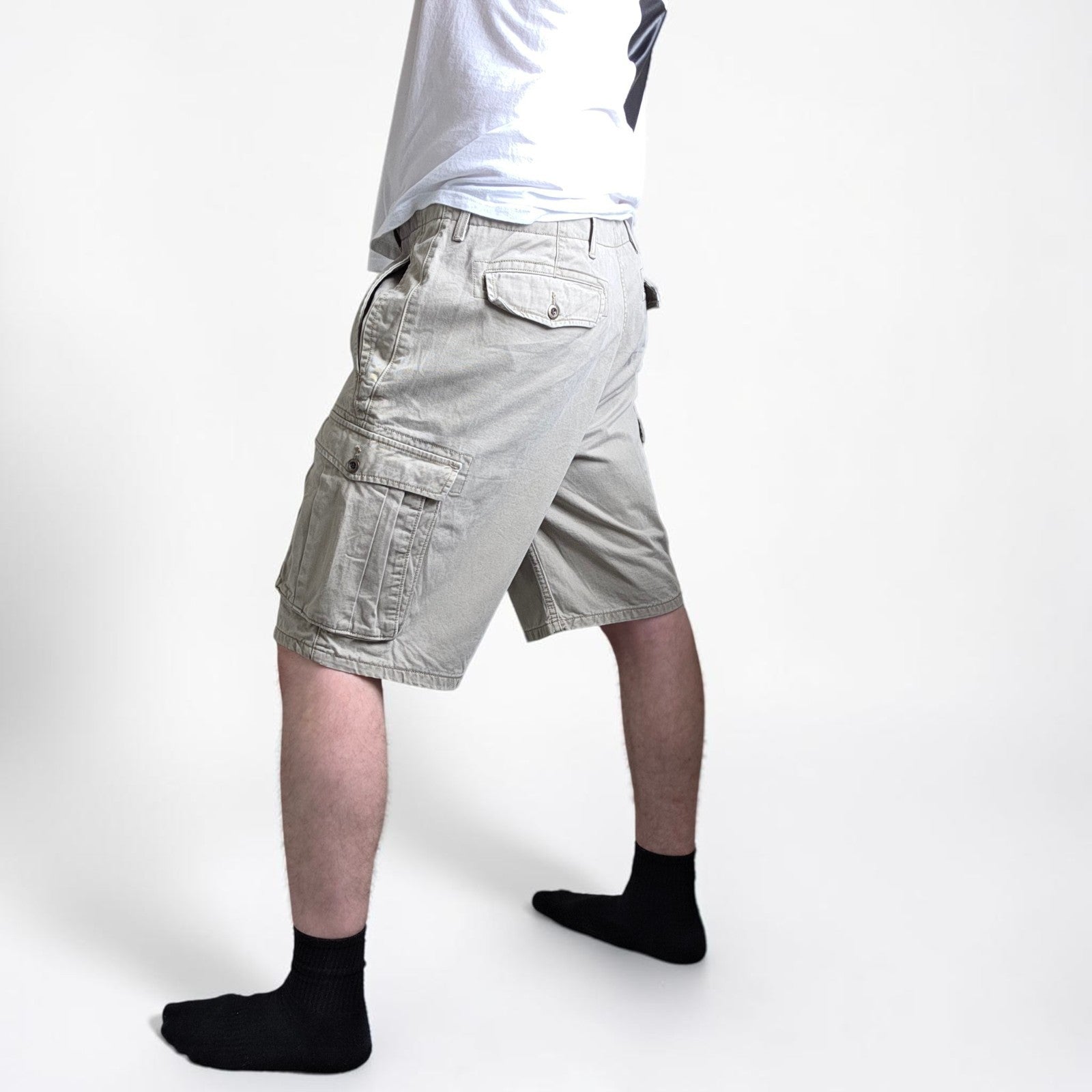 Levi's beige cargo shorts with utility pockets and cotton material, very good condition.