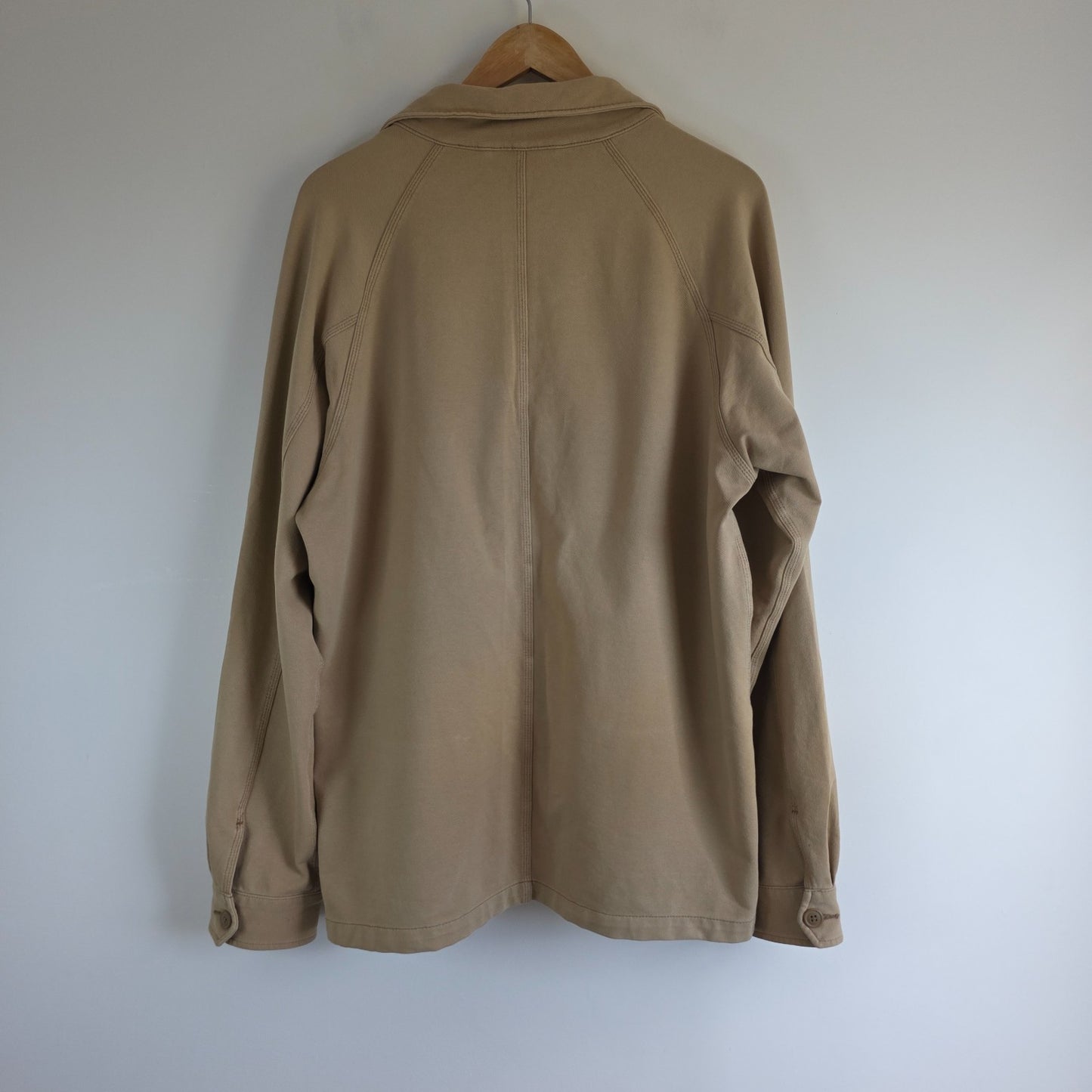 Uniqlo beige chore jacket medium cotton blend with subtle stretch and classic workwear design.
