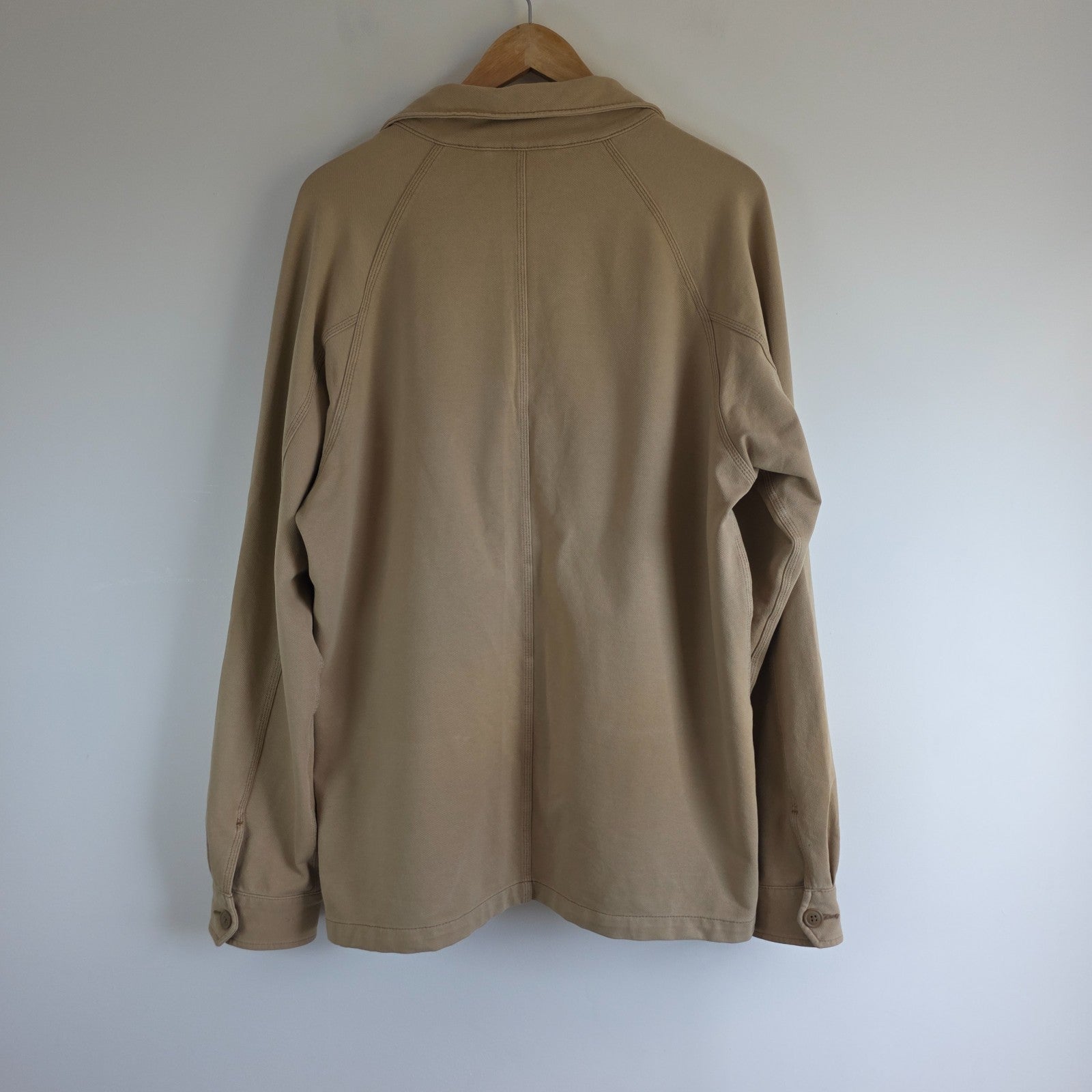 Uniqlo beige chore jacket medium cotton blend with subtle stretch and classic workwear design.