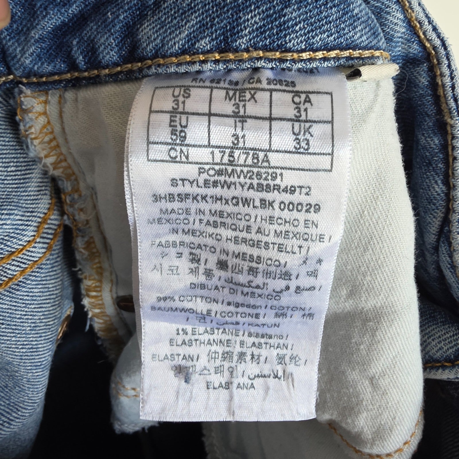 Vintage Guess blue cropped straight jeans with distressed details and high rise fit.