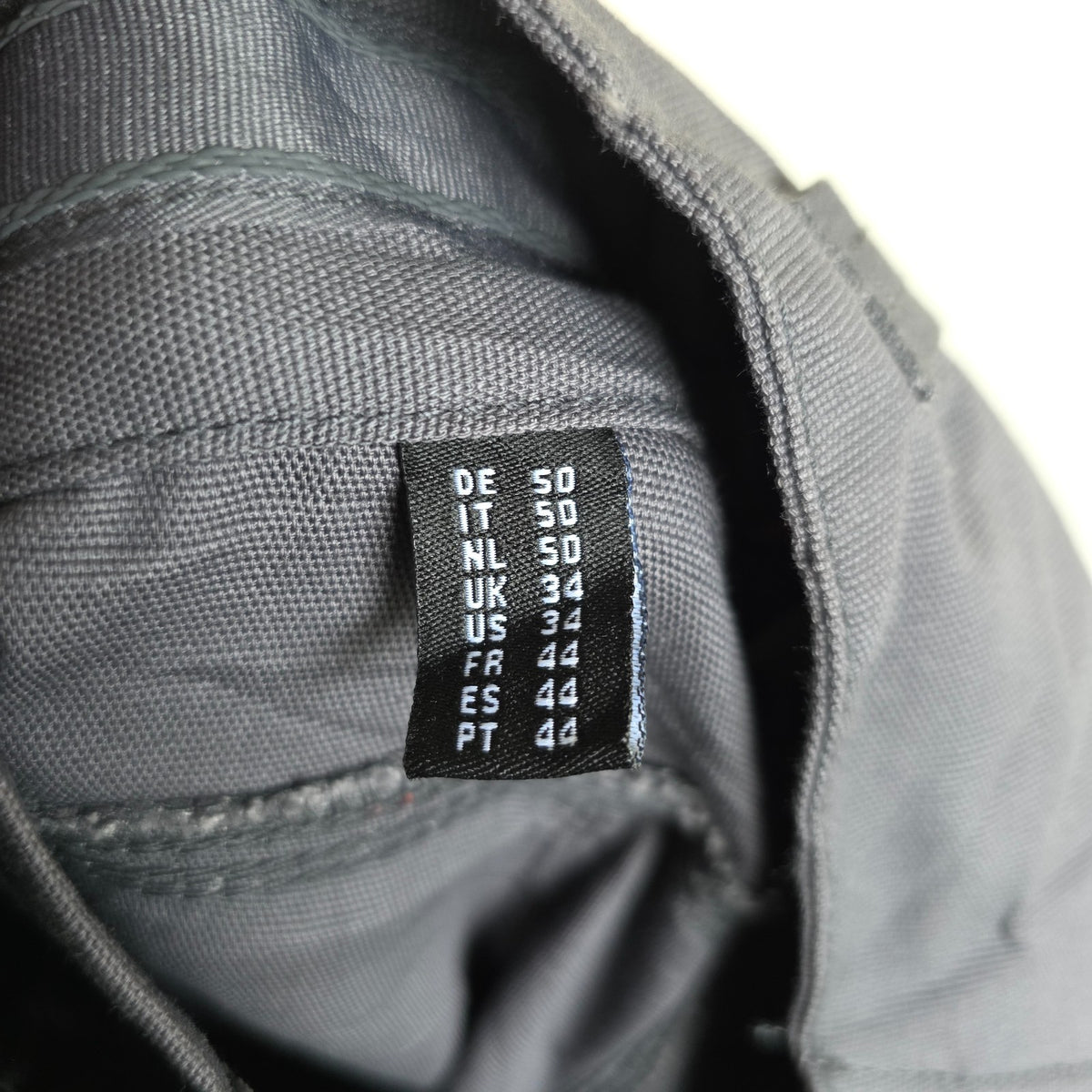Würth Modyf black cargo trousers with reinforced knees and multiple utility pockets.