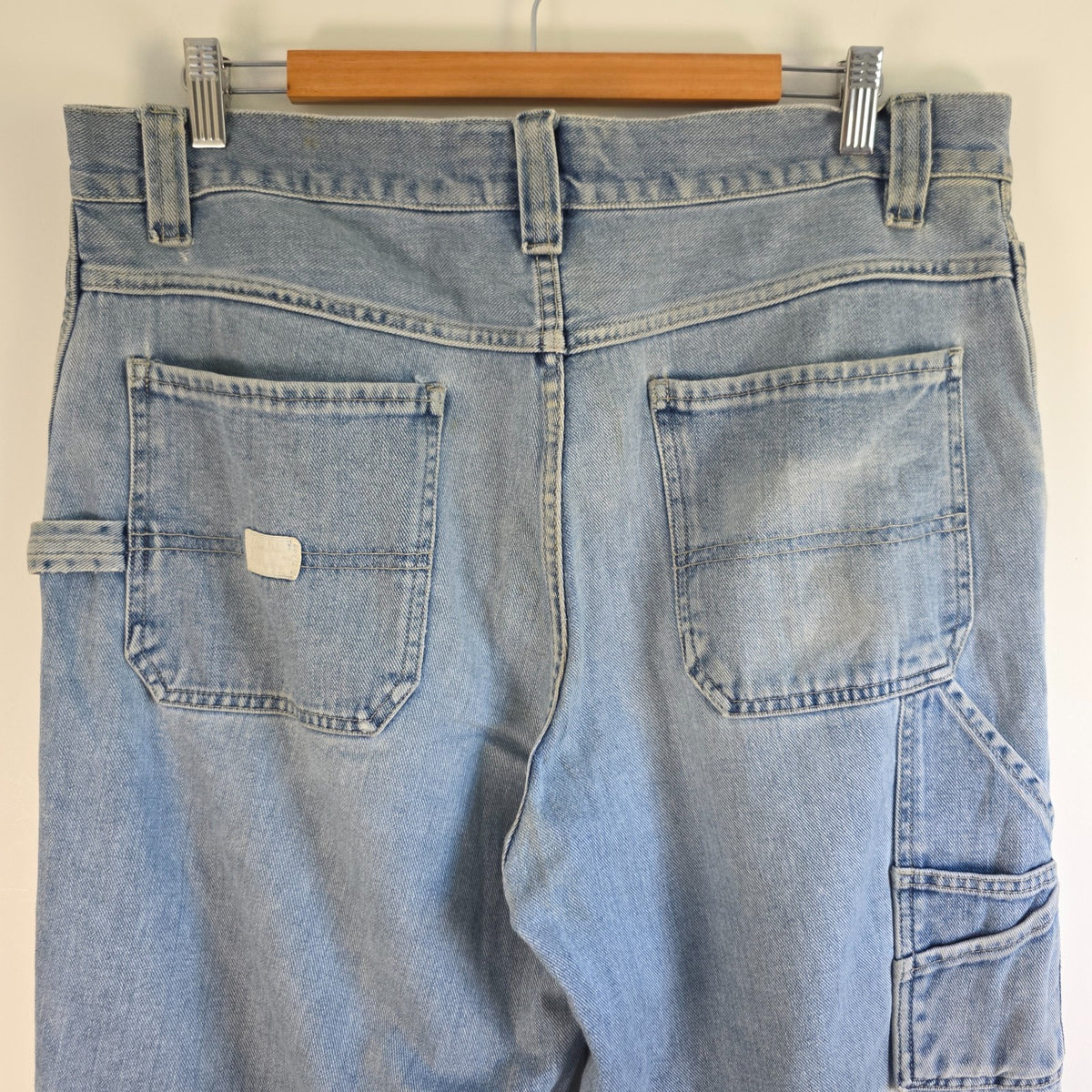 Old Navy blue carpenter jeans with hammer loop and utility pockets, 100% cotton.