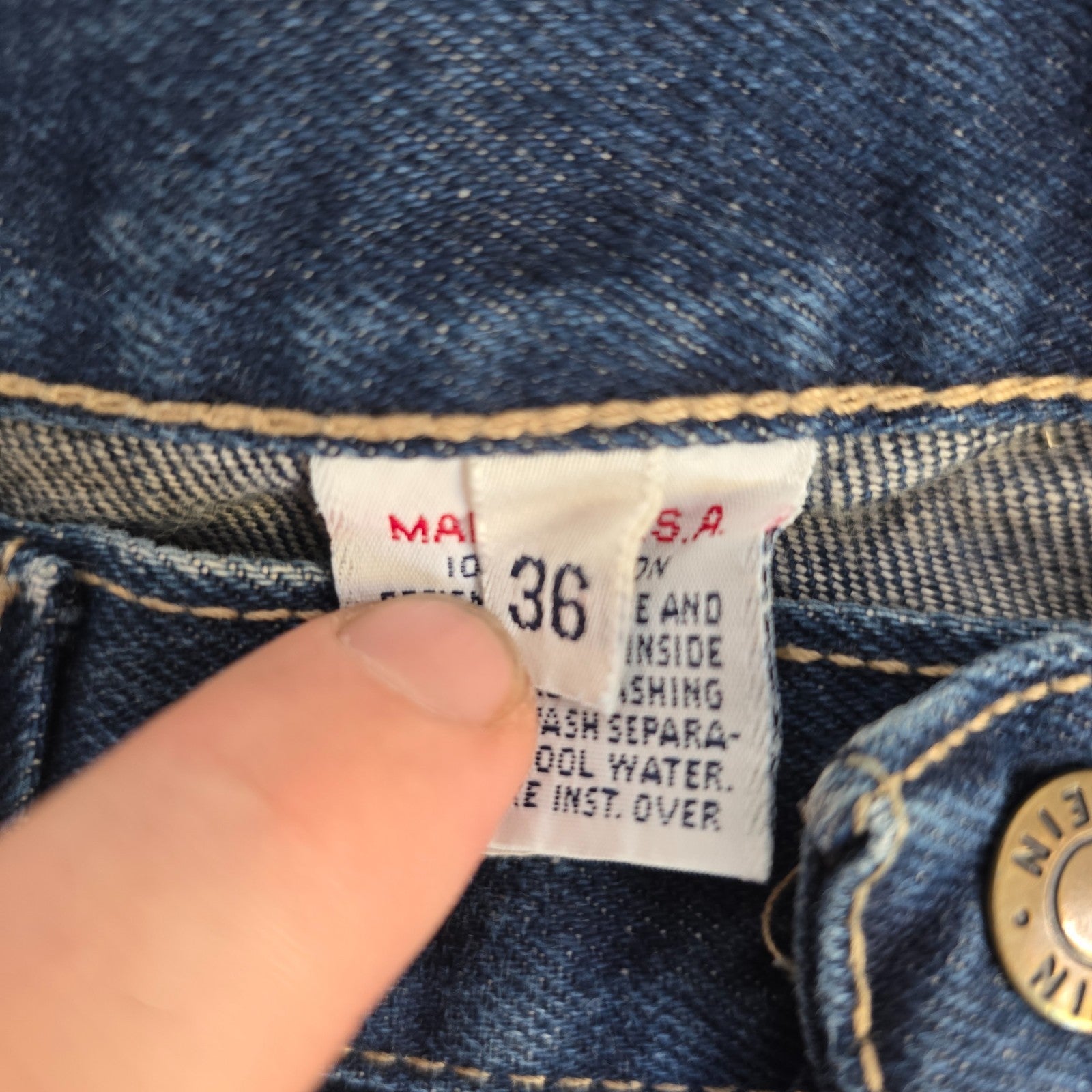 Calvin Klein blue straight leg jeans with vintage 90s style and cotton material.