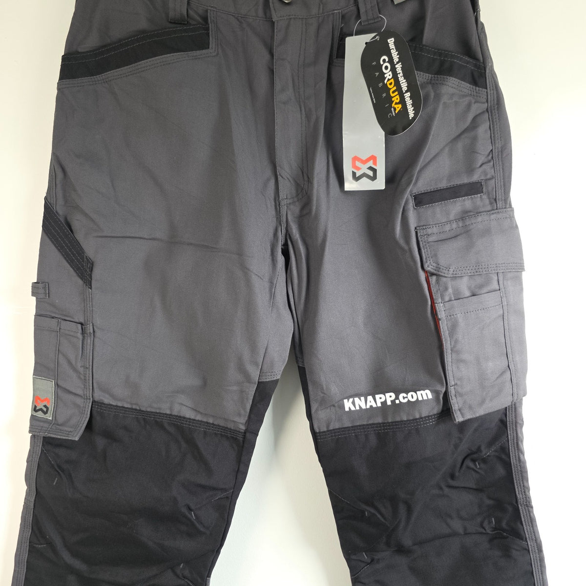 Würth Modyf black cargo trousers with reinforced knees and multiple utility pockets.