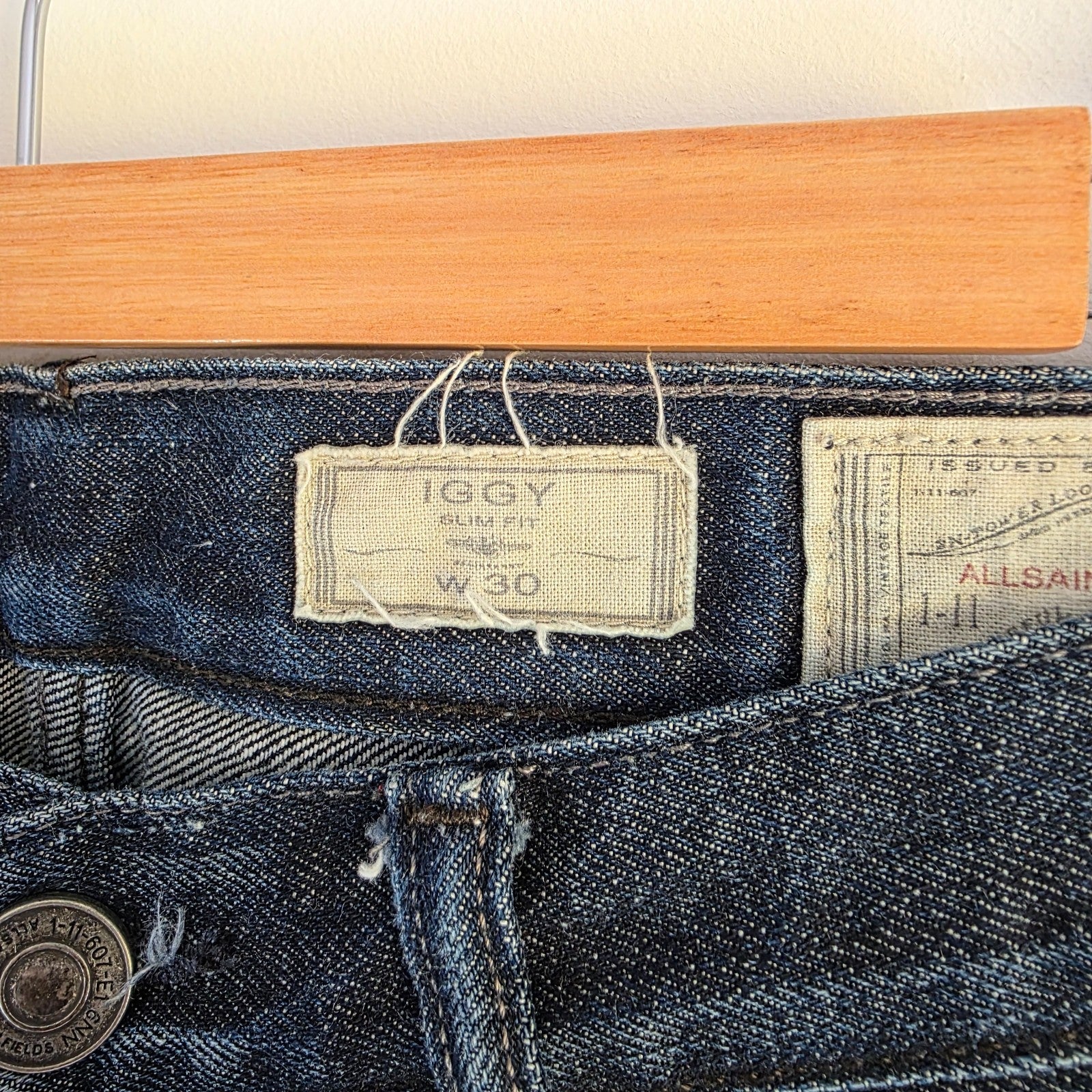 AllSaints blue straight jeans dark wash denim with subtle fading and slim fit.