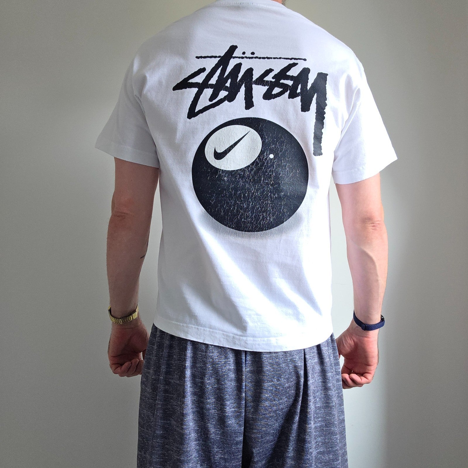 Stüssy x Nike white t-shirt with large 8 Ball back print and cotton material.