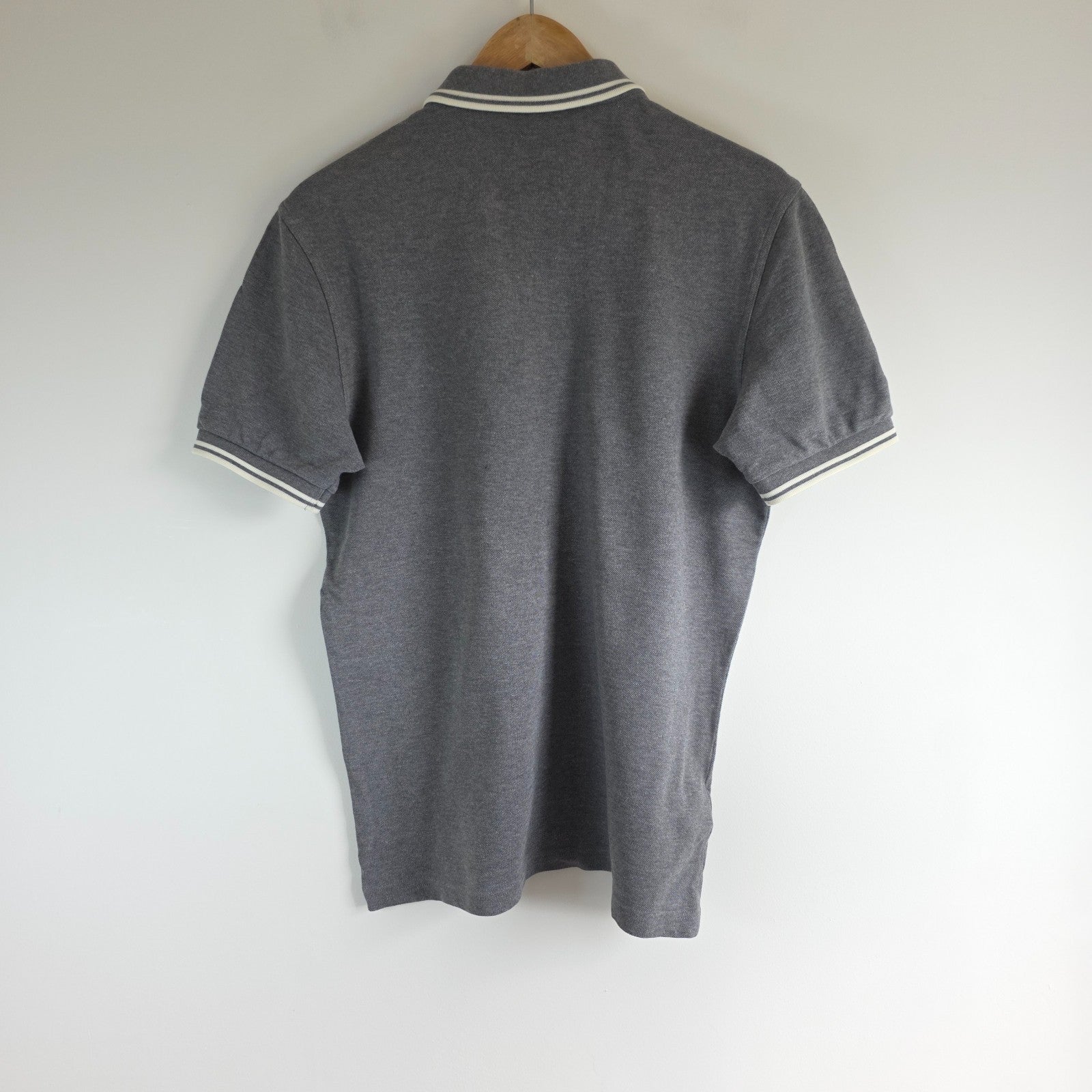 Fred Perry grey polo shirt with white twin tipping and classic laurel logo.