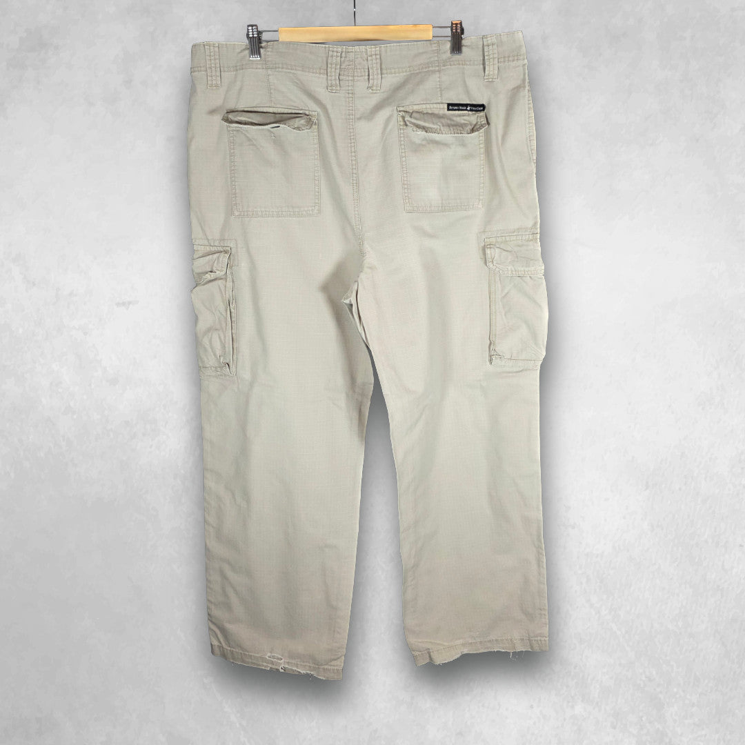 Polo Ralph Lauren beige cargo trousers with multiple pockets and straight leg cut.