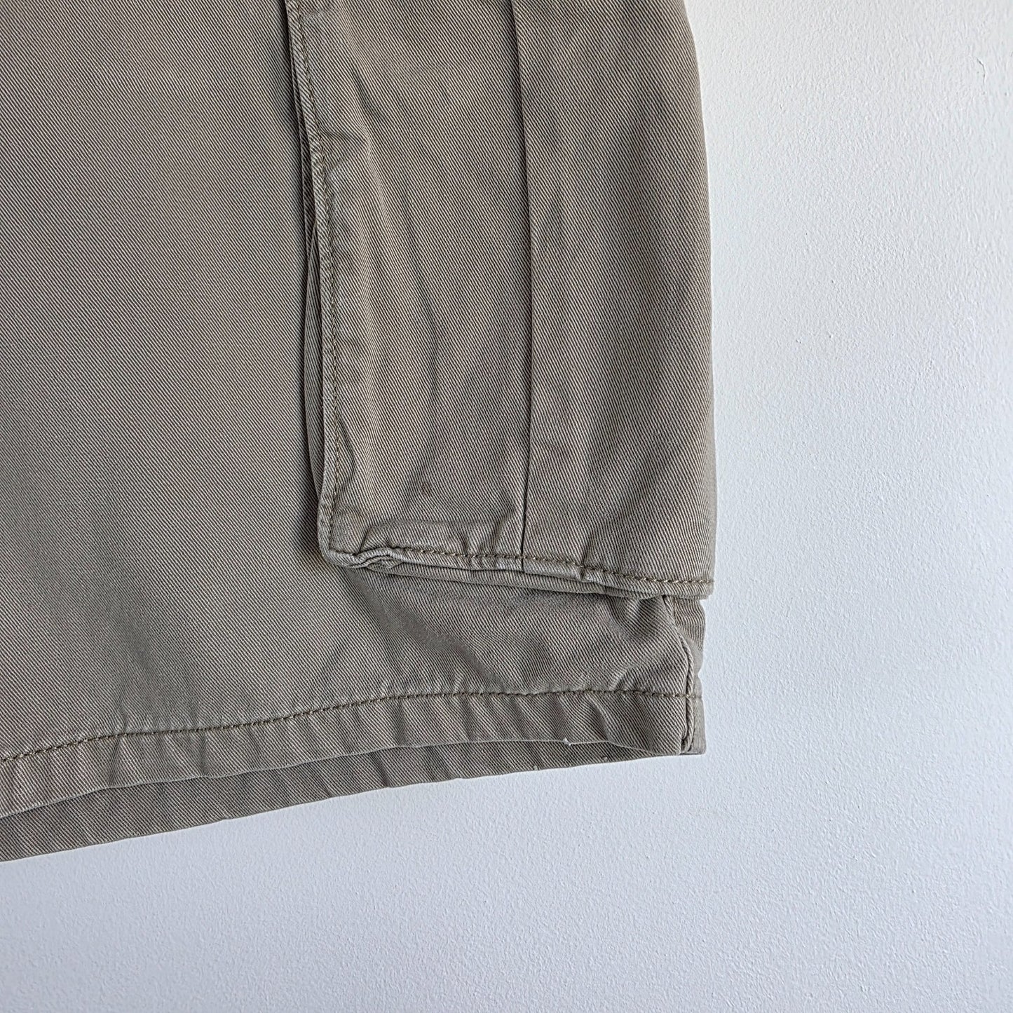 Levi's beige cargo shorts with utility pockets and cotton material, very good condition.