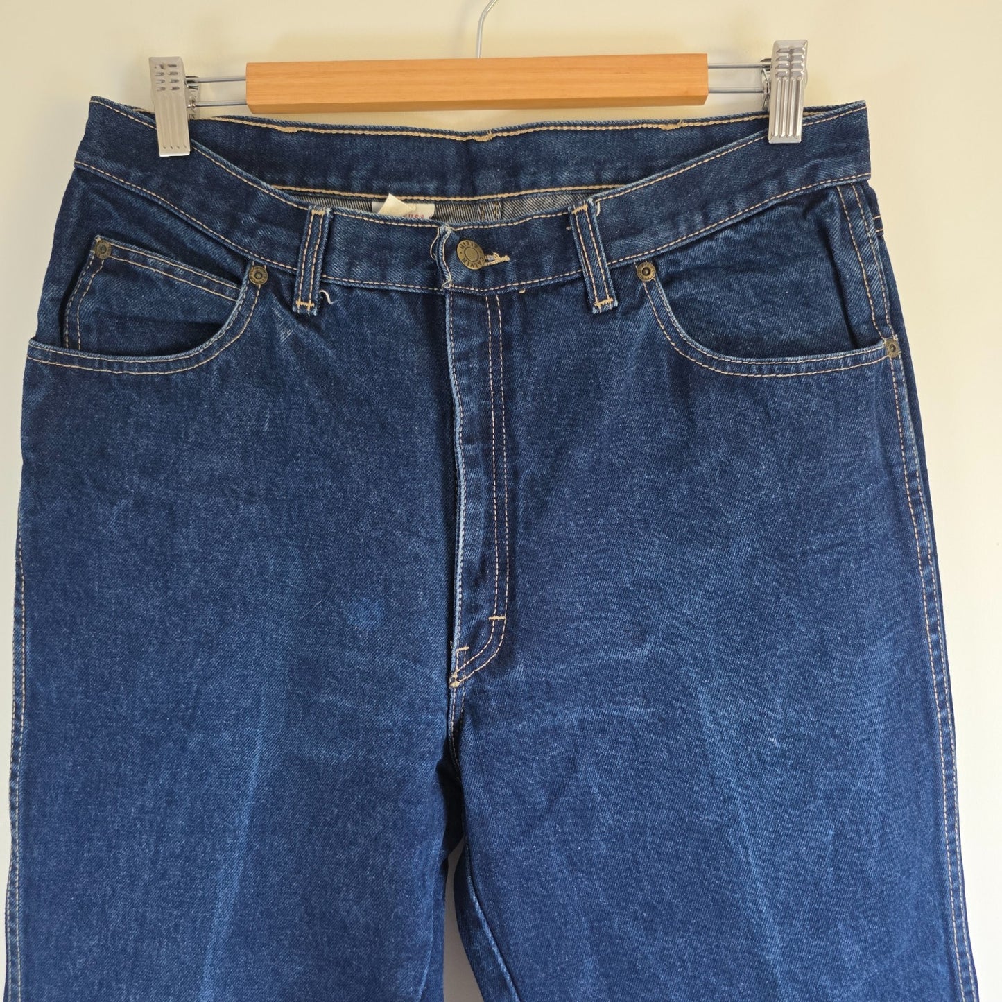 Calvin Klein blue straight leg jeans with vintage 90s style and cotton material.