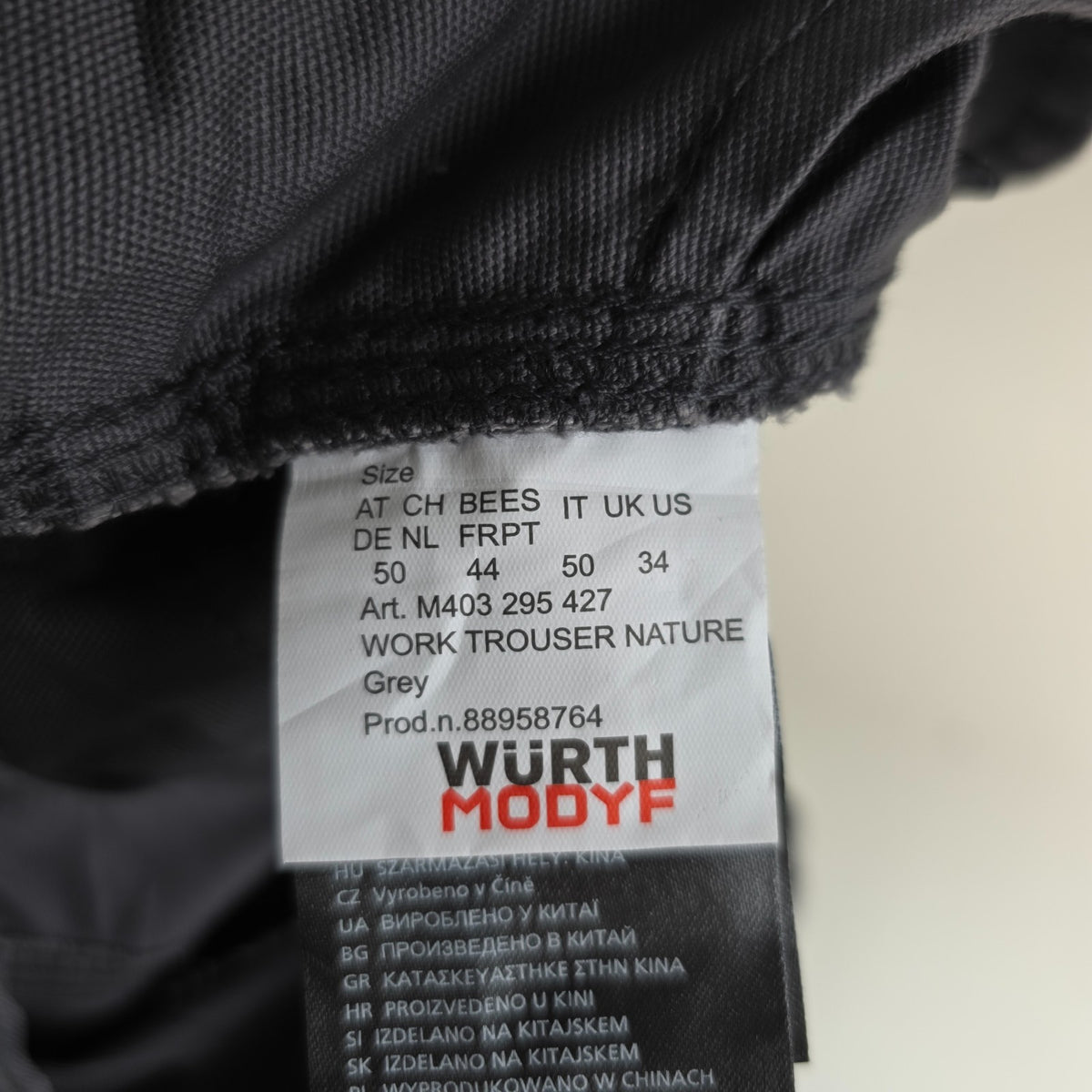 Würth Modyf black cargo trousers with reinforced knees and multiple utility pockets.